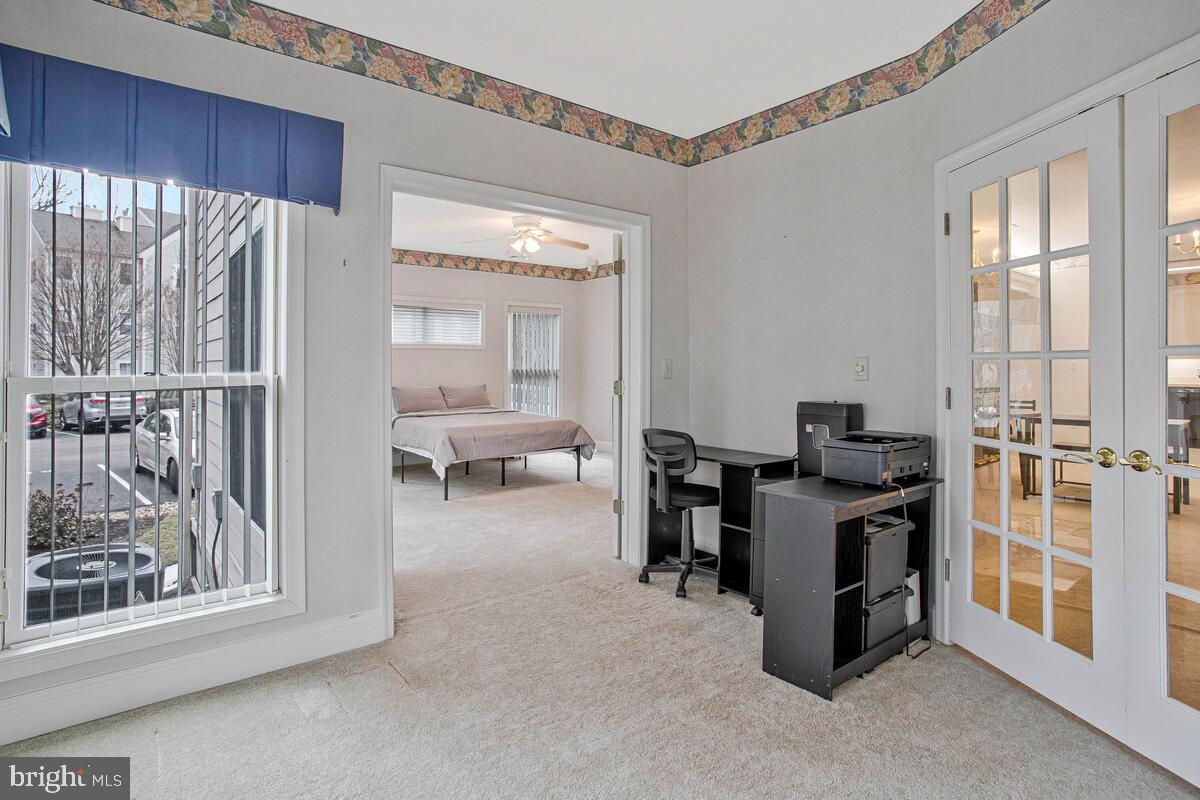 501 Runabout Loop, Unit 501 Solomons, MD 20688 - Photo 29 of 36 a view of a livingroom with workspace and a window