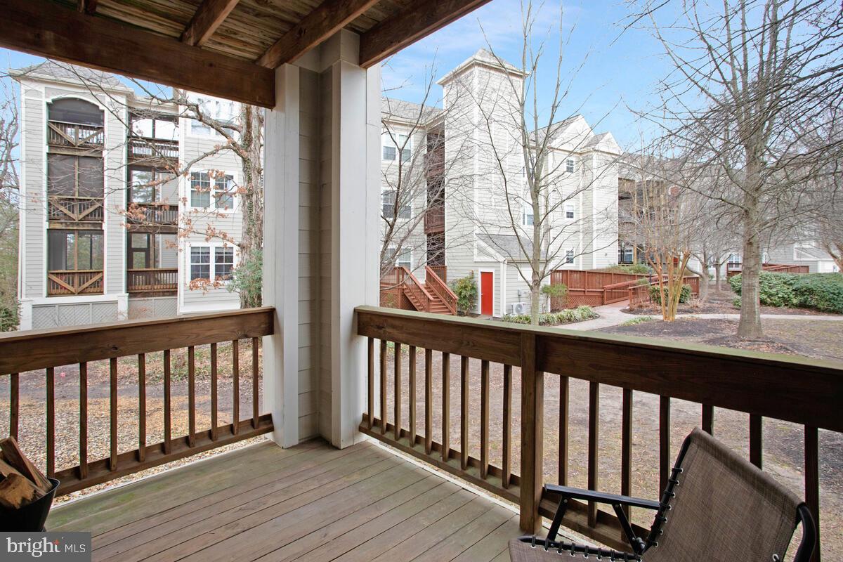 501 Runabout Loop, Unit 501 Solomons, MD 20688 - Photo 31 of 36 a view of a balcony with wooden floor and fence