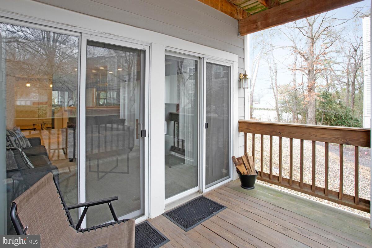 501 Runabout Loop, Unit 501 Solomons, MD 20688 - Photo 33 of 36 a view of a balcony with wooden floor