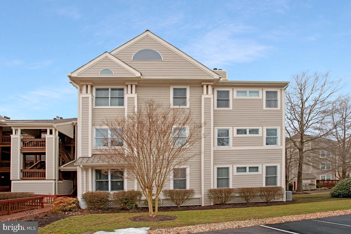 501 Runabout Loop, Unit 501 Solomons, MD 20688 - Photo 4 of 36 a front view of a building with a yard