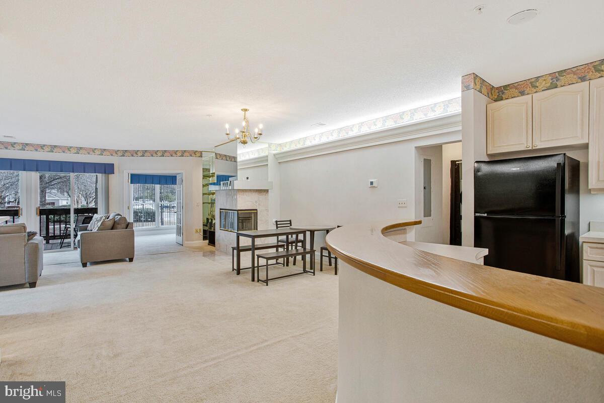 501 Runabout Loop, Unit 501 Solomons, MD 20688 - Photo 7 of 36 a kitchen with granite countertop a refrigerator and a stove