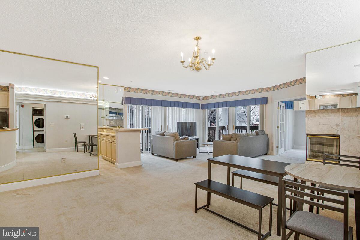 501 Runabout Loop, Unit 501 Solomons, MD 20688 - Photo 8 of 36 a living room with furniture and a fireplace