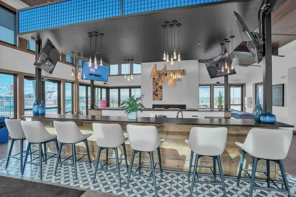 a dining area with chairs and table