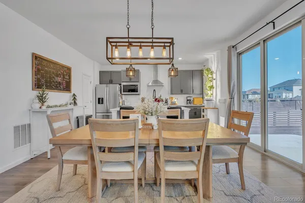 a dining room with furniture and window