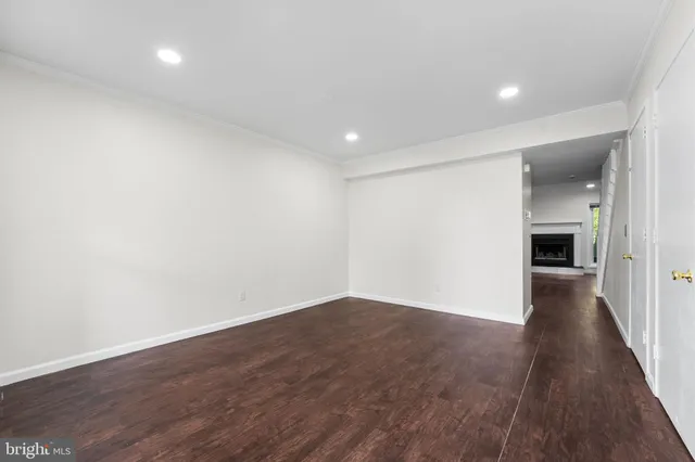 wooden floor in a hall with a window