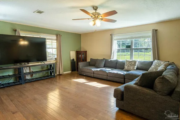 a living room with furniture and a flat screen tv