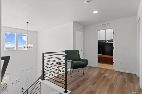 a living room with furniture and a closet