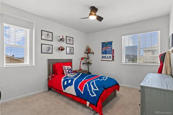 a bedroom with a bed and a couch