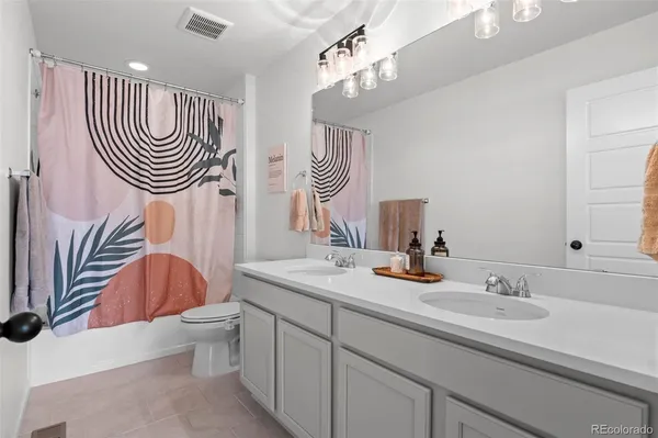 a living room with furniture pool table and a flat screen tv