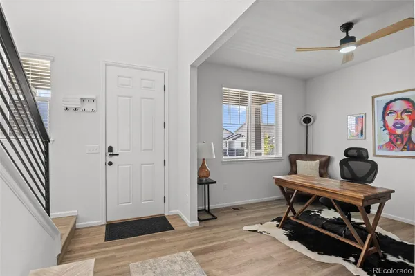 a work room with furniture and windows