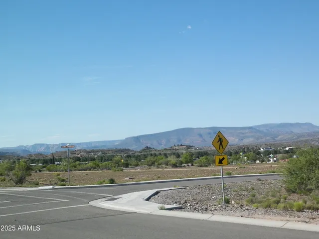 a view of a road with an ocean view