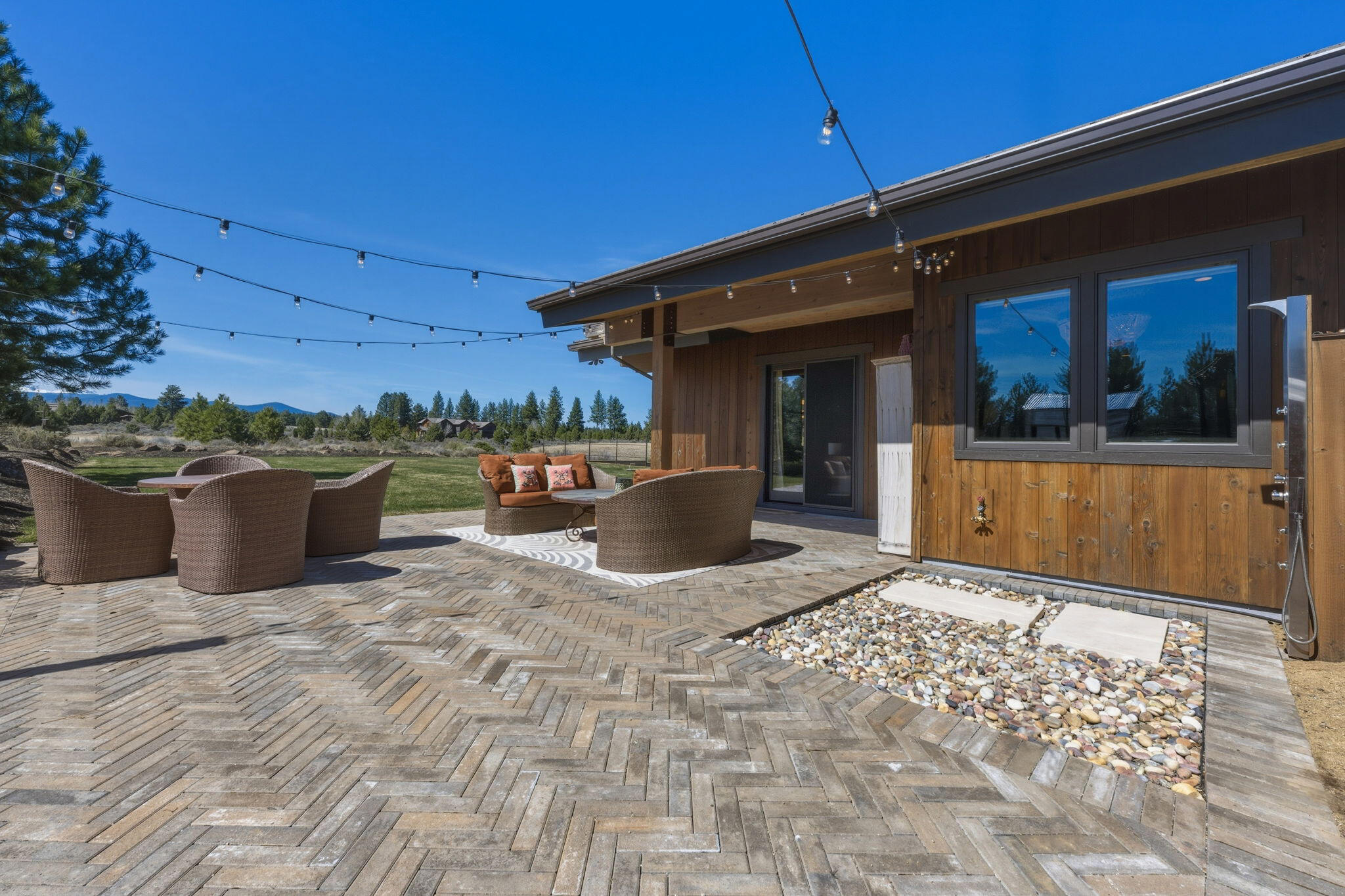 19100 Macalpine Loop Bend, OR 97702 - Photo 27 of 56 Primary ensuite - private patio with outdoor shower