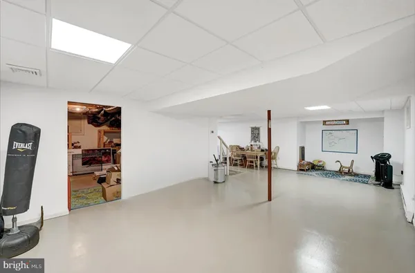 a view of a livingroom with furniture and a window