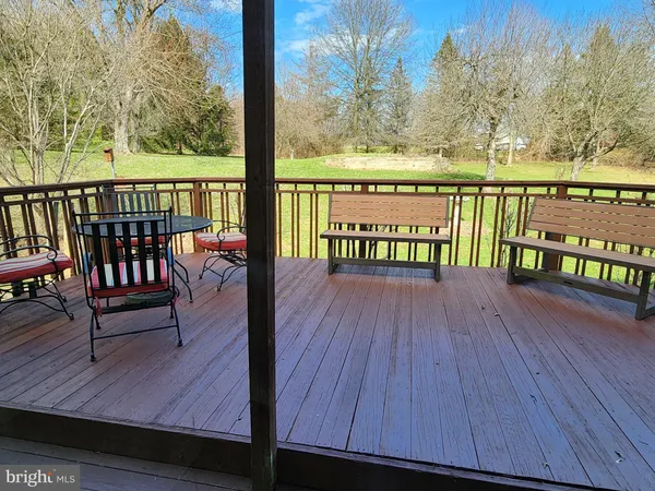 a view of a wooden deck with a bench