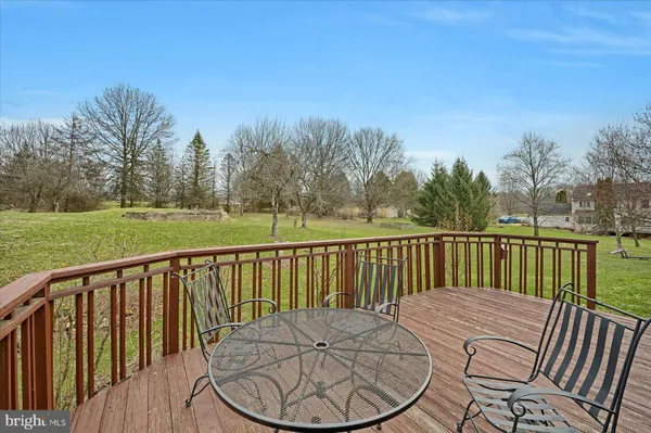 a view of a deck with a backyard