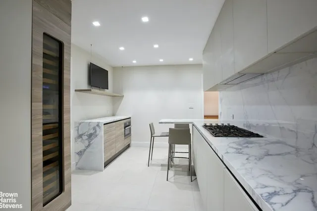 a kitchen with a table and chairs