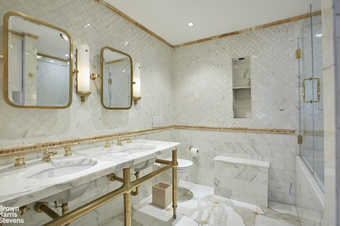 525 East 80th Street, Unit 7BC Manhattan, NY 10075 - Photo 6 of 13 a bathroom with a granite countertop sink a mirror and shower