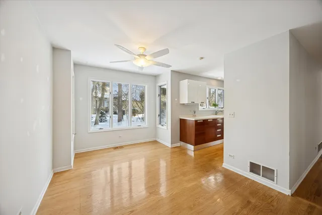 a spacious bathroom with a tub sink and a window
