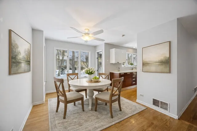 a view of a dining room with furniture window and wooden floor