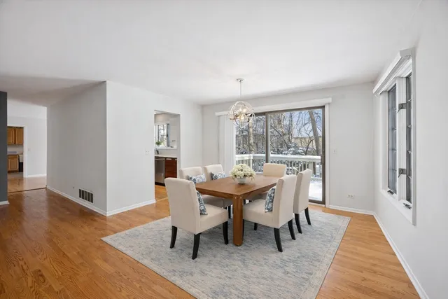 a dining room with furniture window wooden floor