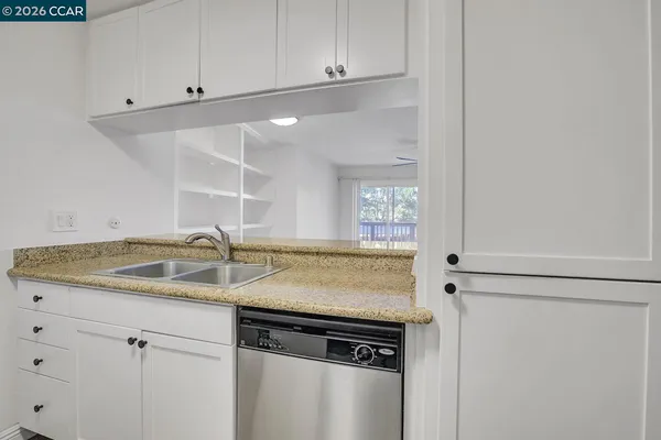 a view of a kitchen cabinets and a sink