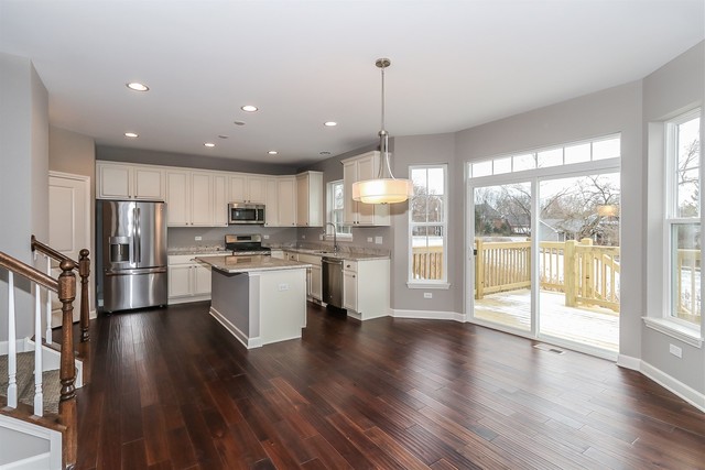 1228 Declan Court, Unit 4 Naperville, IL 60563 - Photo 14 of 32 a kitchen with stainless steel appliances granite countertop a refrigerator a oven a stove and a wooden floors