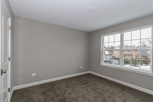 1228 Declan Court, Unit 4 Naperville, IL 60563 - Photo 23 of 32 an empty room with a window
