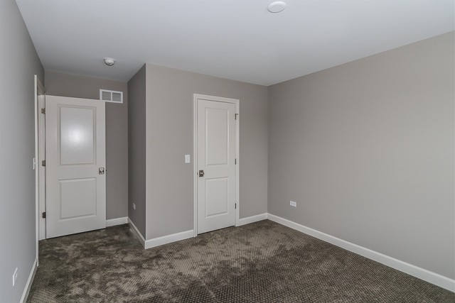 1228 Declan Court, Unit 4 Naperville, IL 60563 - Photo 24 of 32 a view of an empty room