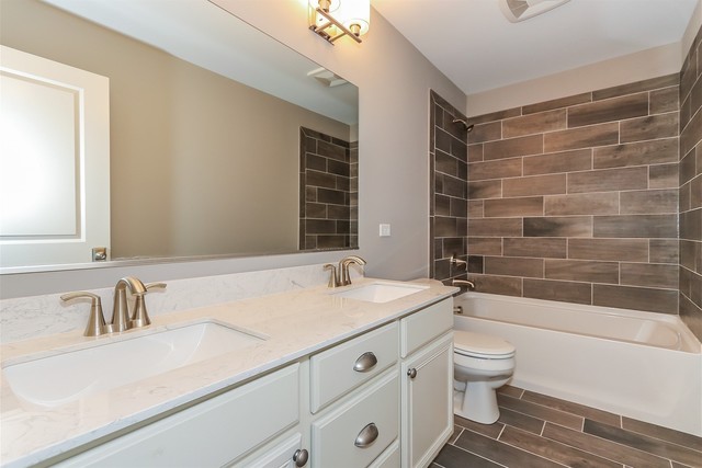 1228 Declan Court, Unit 4 Naperville, IL 60563 - Photo 25 of 32 a bathroom with a granite countertop sink toilet and shower