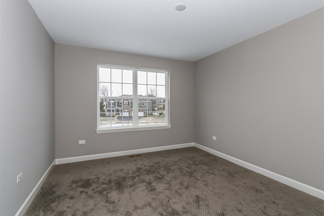 1228 Declan Court, Unit 4 Naperville, IL 60563 - Photo 26 of 32 an empty room with a window