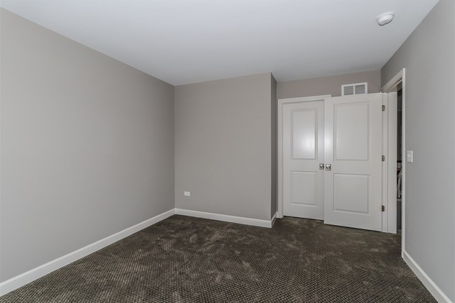 1228 Declan Court, Unit 4 Naperville, IL 60563 - Photo 27 of 32 a view of an empty room