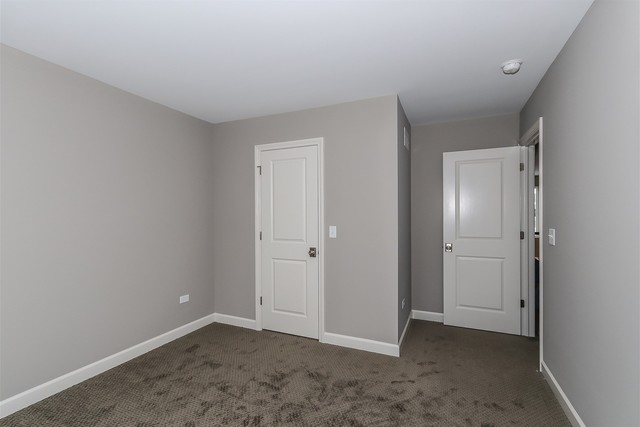 1228 Declan Court, Unit 4 Naperville, IL 60563 - Photo 29 of 32 a view of an empty room