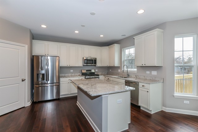 1228 Declan Court, Unit 4 Naperville, IL 60563 - Photo 10 of 32 a kitchen with a center island wooden floor and stainless steel appliances