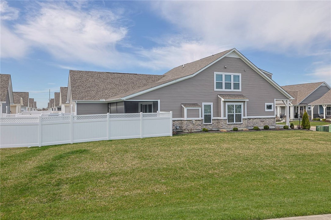 5013 Arena Court Hamilton, OH 45011 - Photo 39 of 41 This charming residence features a well-maintained lawn and a private vinyl fence, creating a welcoming outdoor space.