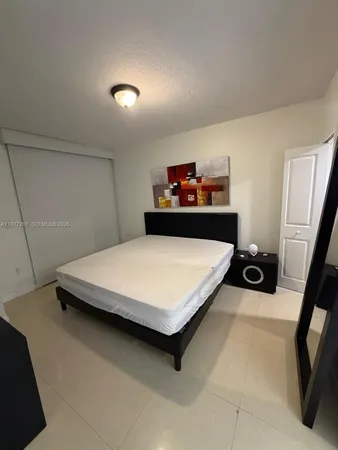 a kitchen with granite countertop a sink stainless steel appliances and cabinets