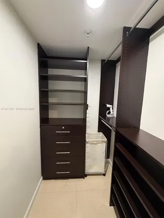 a bathroom with a granite countertop sink a toilet and bathtub