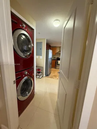 a view of a hallway with washer and dryer