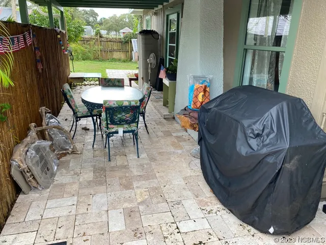 a living room with a table and a fireplace