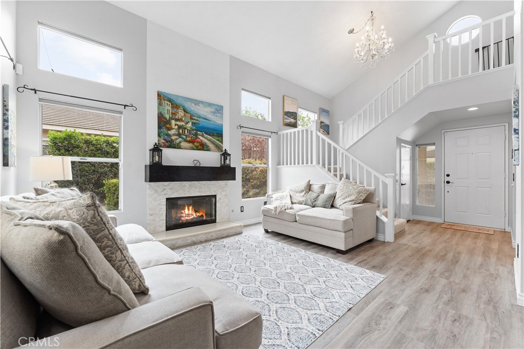 853 Cheyenne Road Corona, CA 92878 - Photo 5 of 8 a living room with furniture and a fireplace