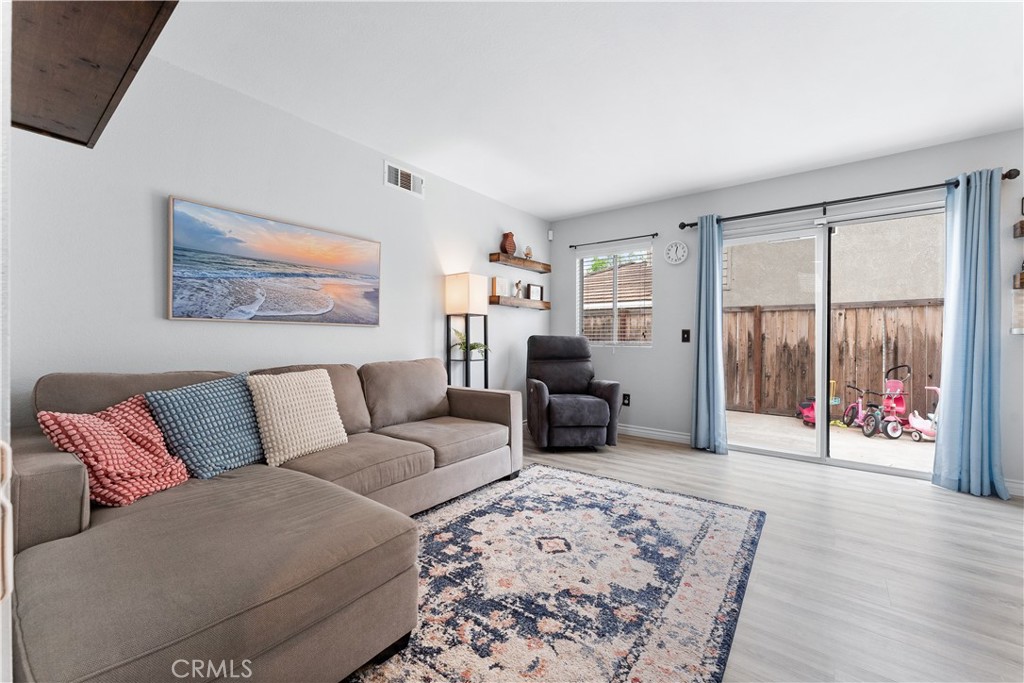 853 Cheyenne Road Corona, CA 92878 - Photo 6 of 8 a living room with furniture and a couch