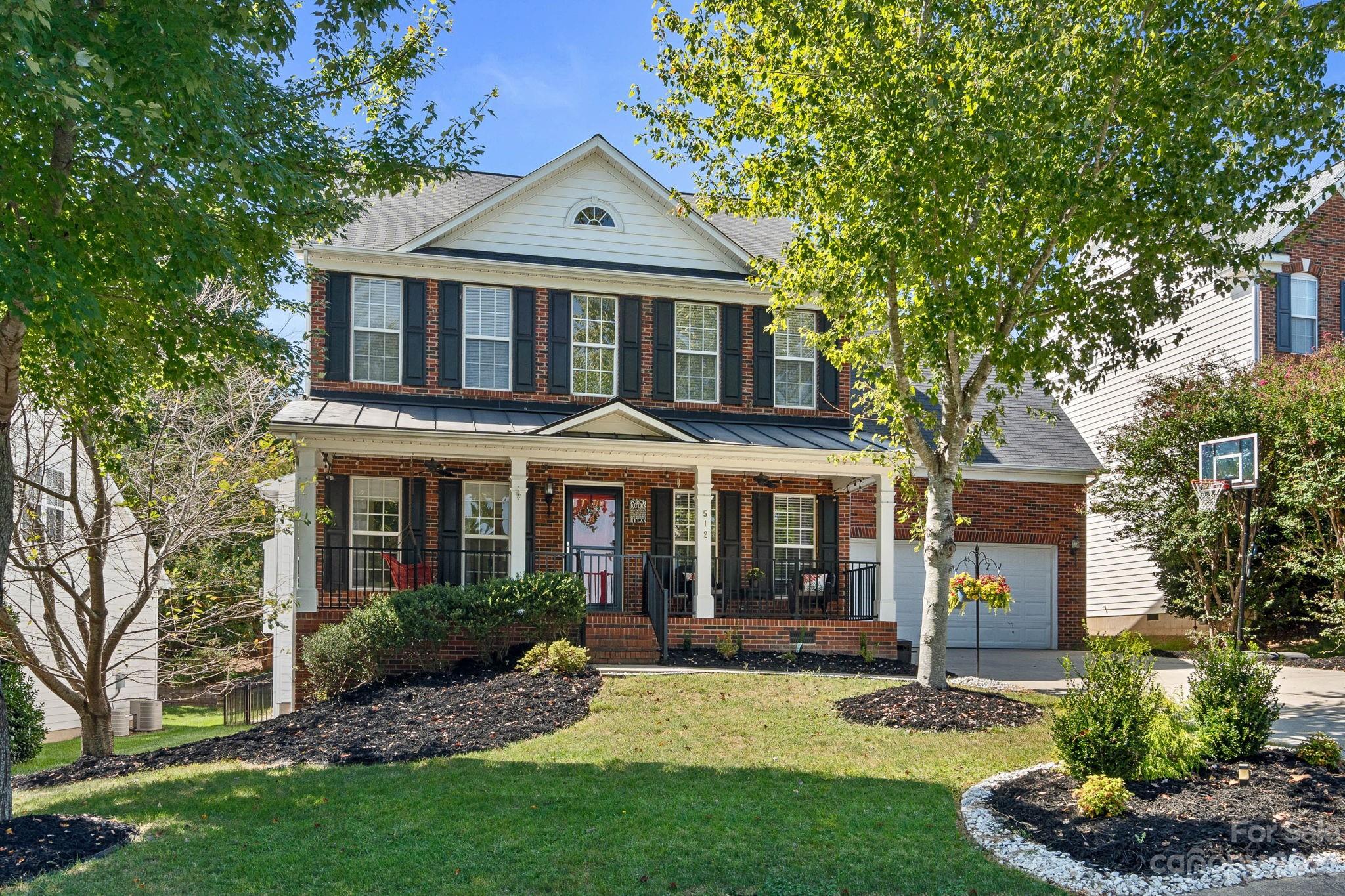 512 St George Road Fort Mill, SC 29708 - Photo 1 of 35 a front view of a house with a yard