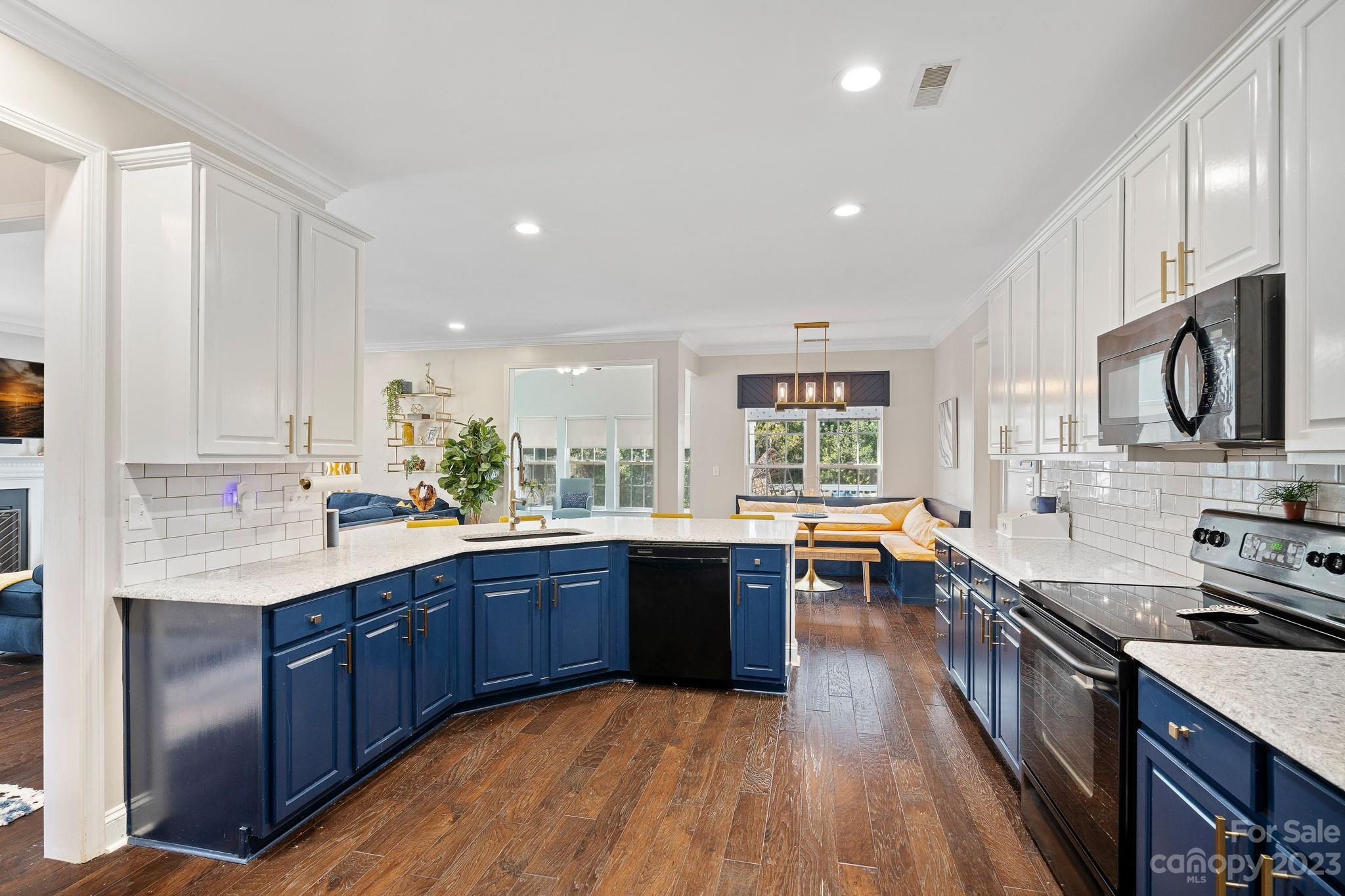 512 St George Road Fort Mill, SC 29708 - Photo 11 of 35 a large kitchen with wooden cabinets and stainless steel appliances