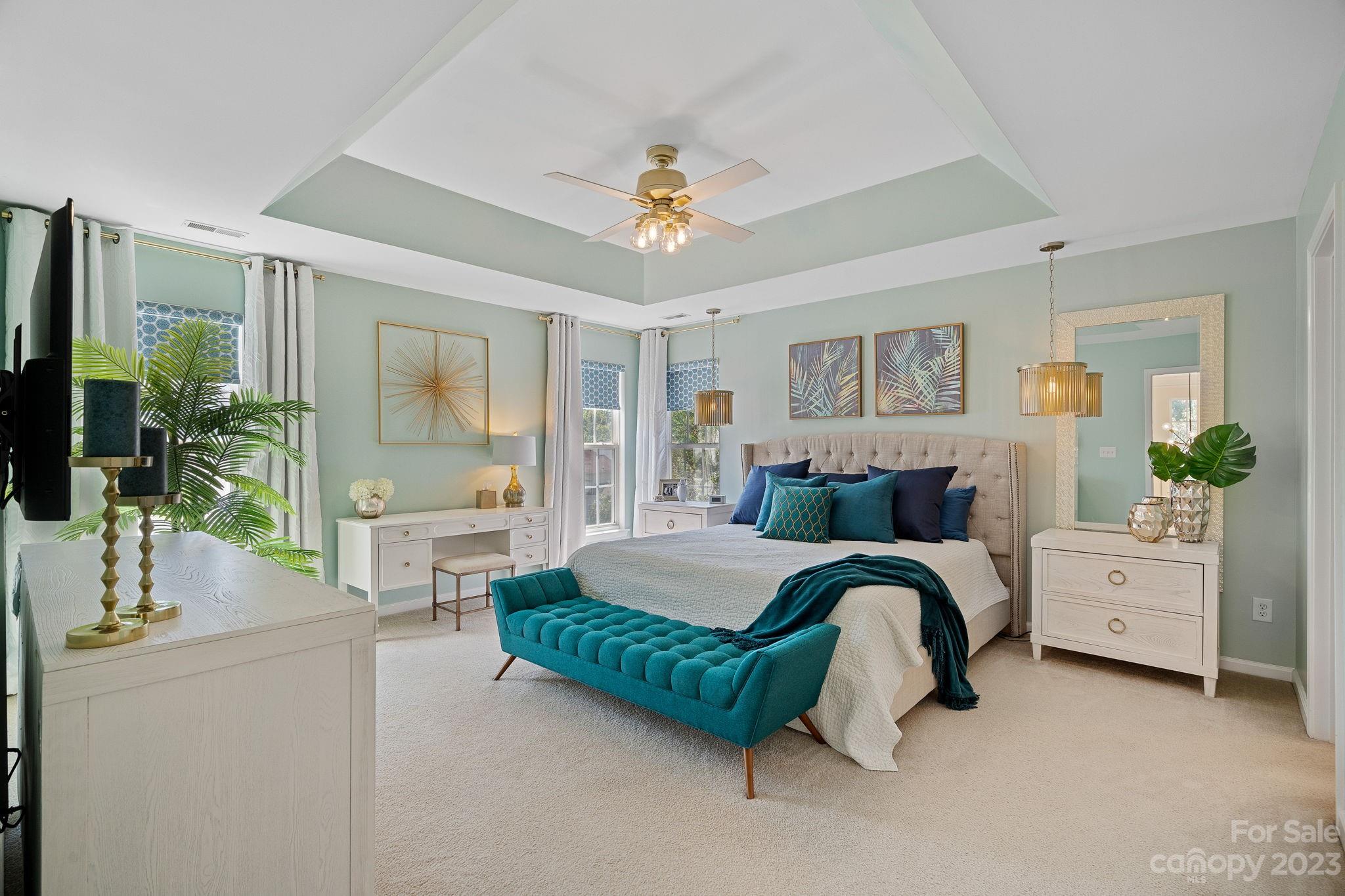 512 St George Road Fort Mill, SC 29708 - Photo 18 of 35 a bedroom with a bed and a chandelier