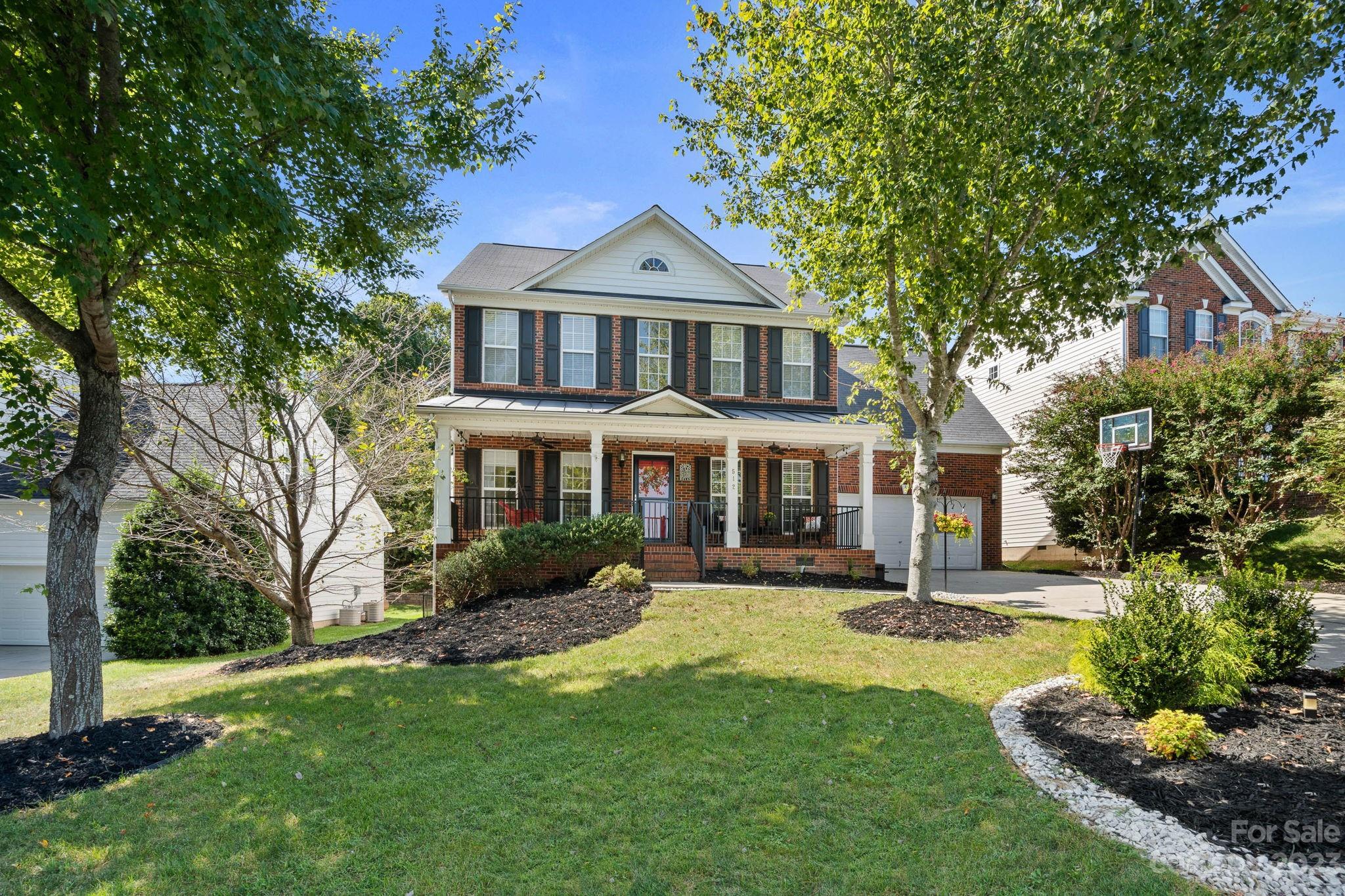 512 St George Road Fort Mill, SC 29708 - Photo 2 of 35 a front view of a house with a yard