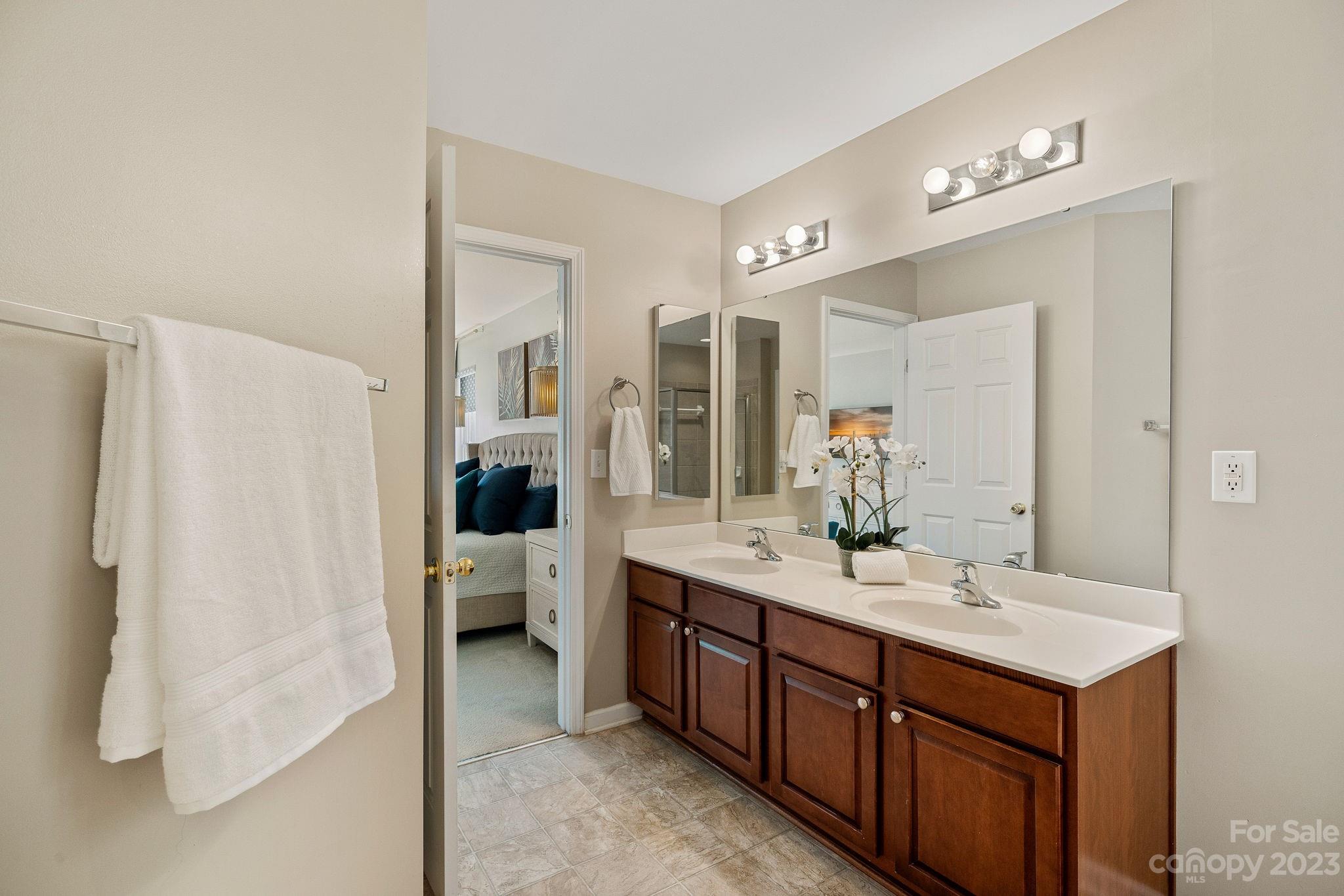 512 St George Road Fort Mill, SC 29708 - Photo 21 of 35 a spacious bathroom with a double vanity sink and mirror