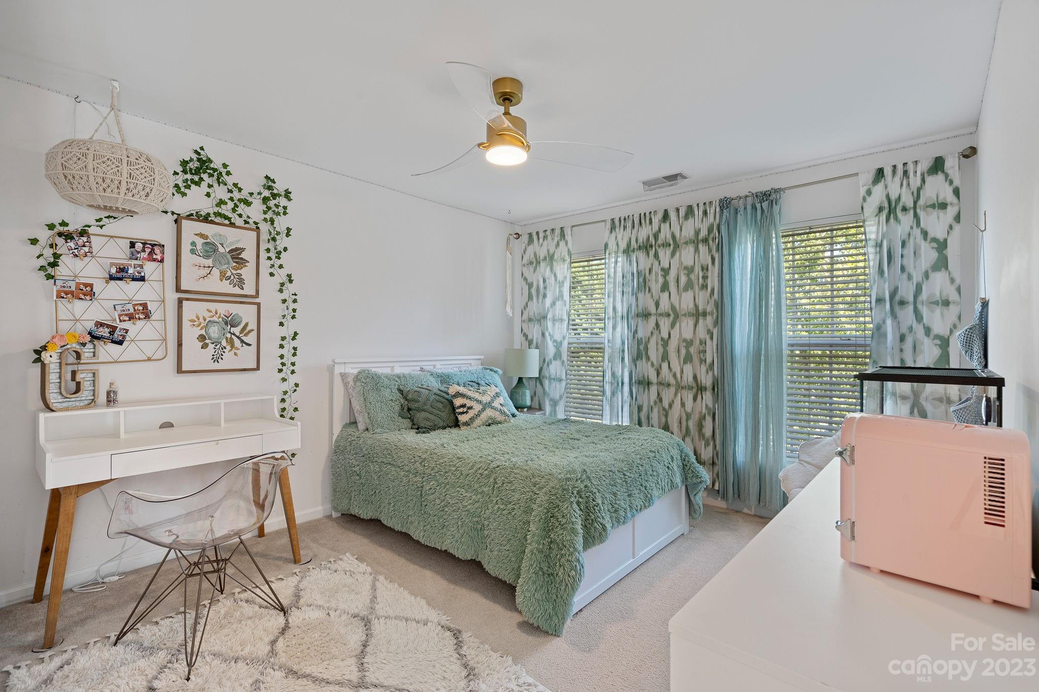 512 St George Road Fort Mill, SC 29708 - Photo 23 of 35 a bedroom with a bed and a table in it with window