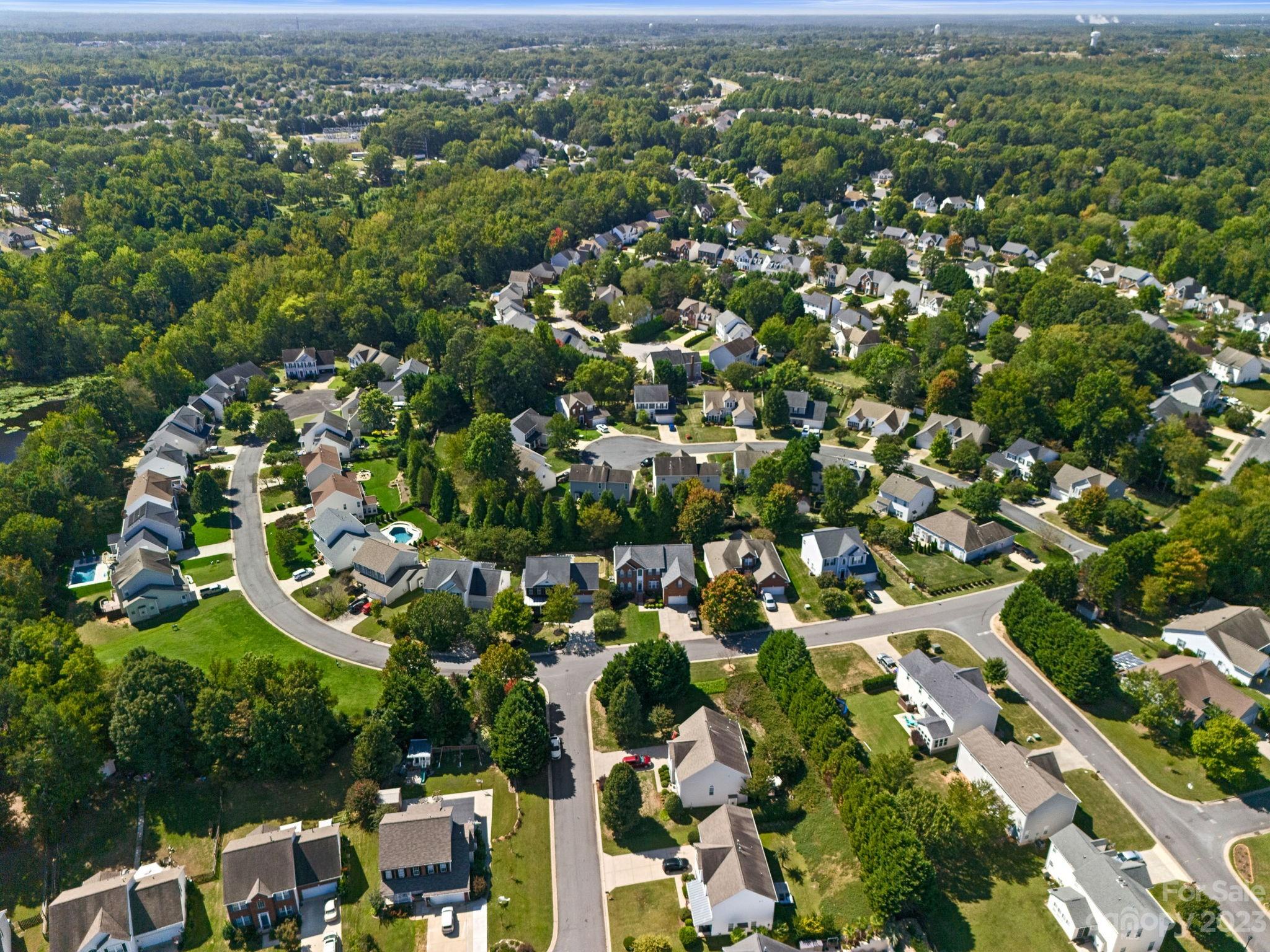 512 St George Road Fort Mill, SC 29708 - Photo 32 of 35 an aerial view of residential houses with outdoor space and trees