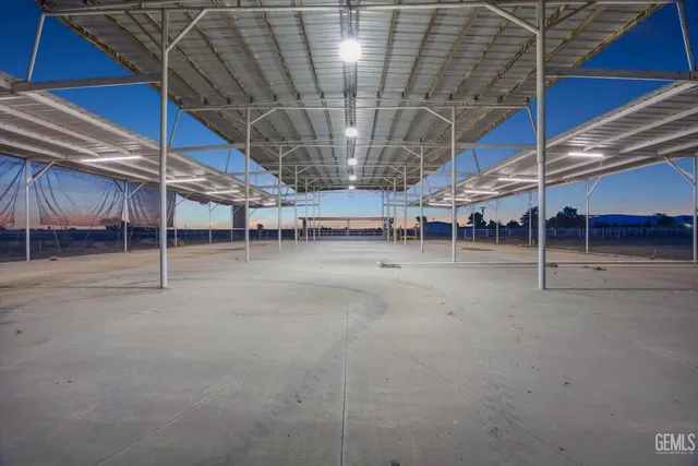 a view of an empty room with wooden roof