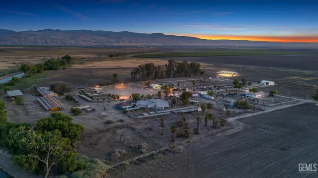 a view of a street with a yard