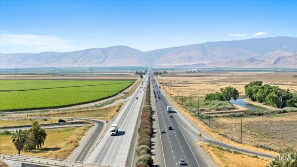 a view of a garage with wooden deck